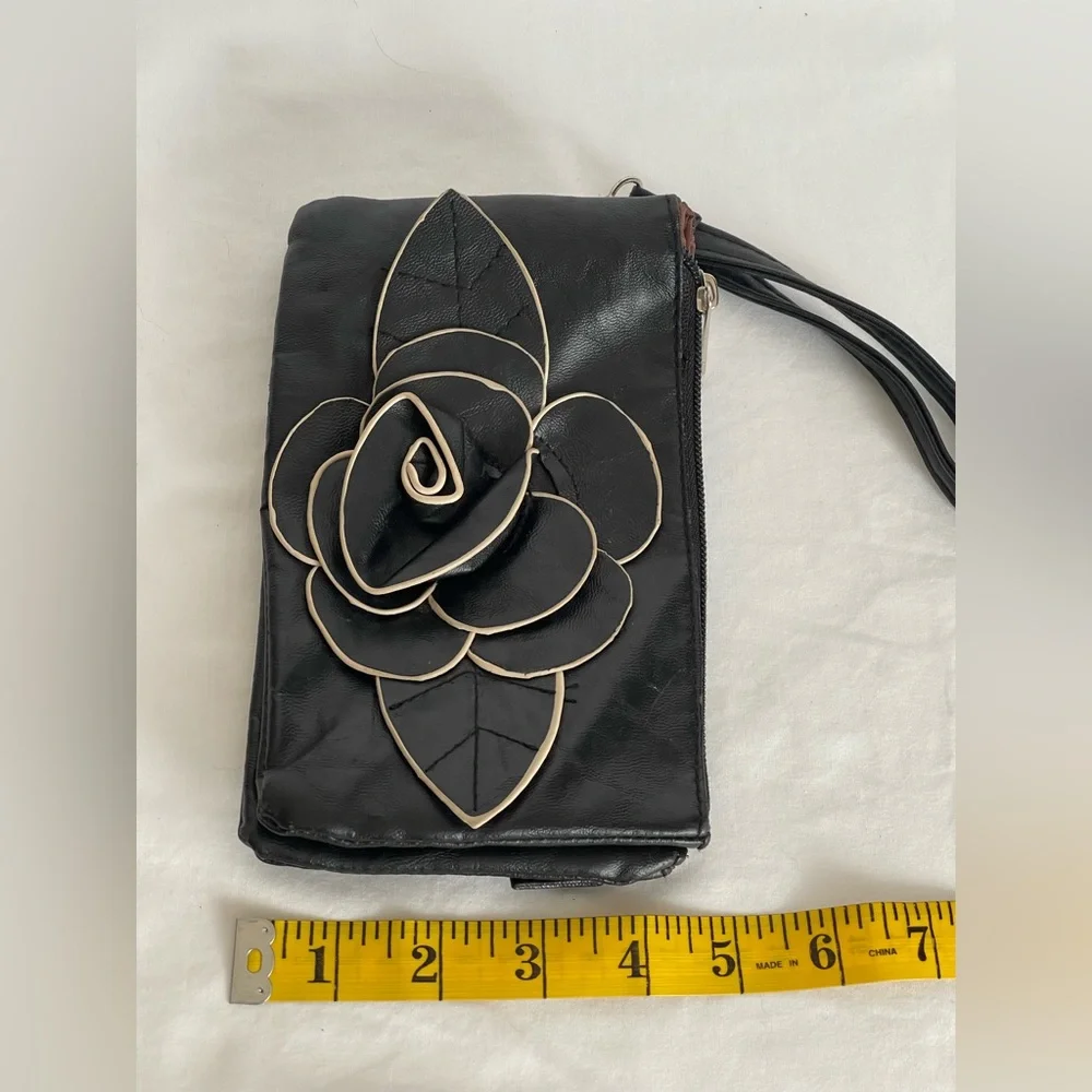 Fun little black faux, leather clutch wristlet three pocket with a zipper